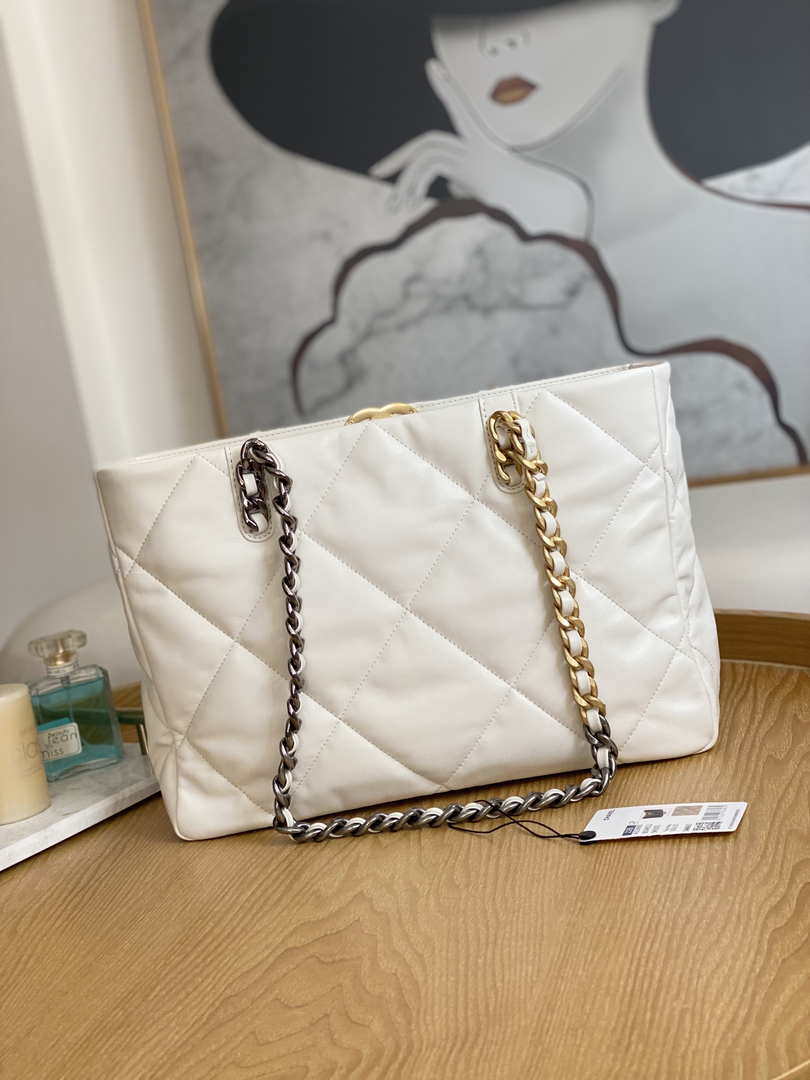Chanel 19 handbag, Shiny lambskin, gold-tone, silver-tone &  ruthenium-finish metal, black — Fashion, CHANEL